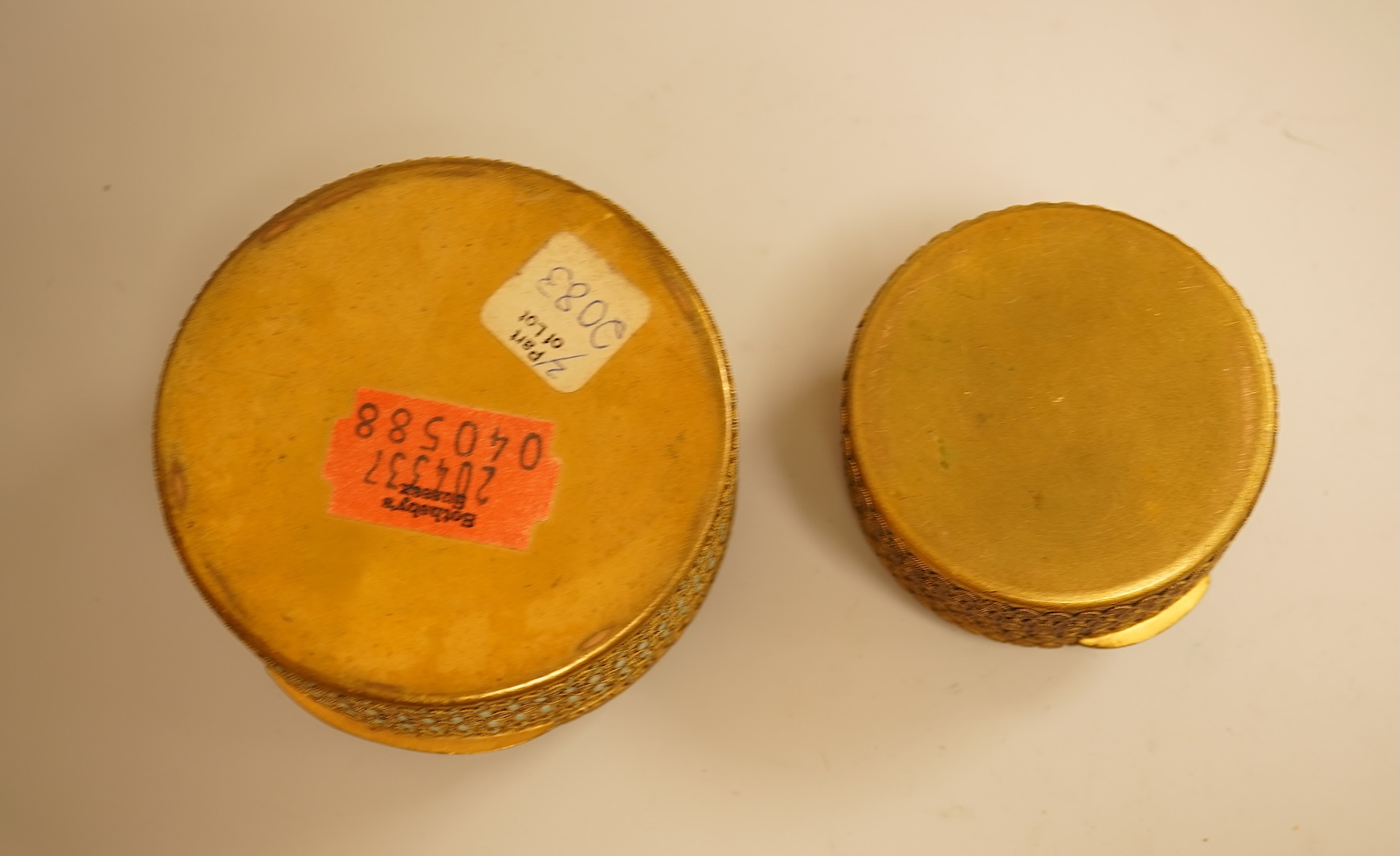 Two Limoges enamel mounted gilt filigree work circular boxes, largest 8cm diameter